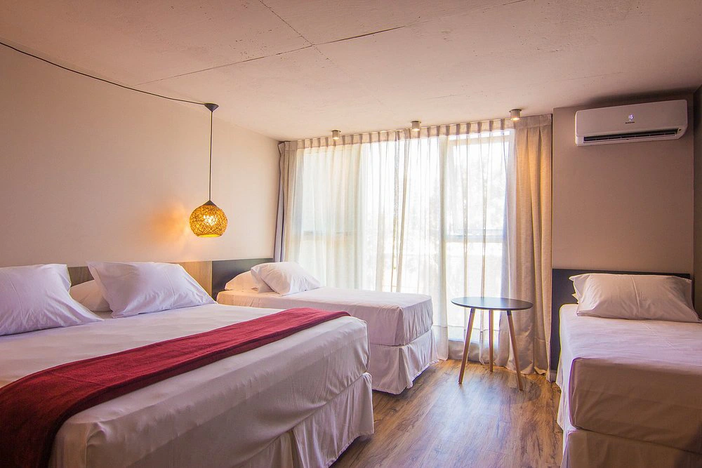 dormitorio_camas_individuales_ciudadano_suites.webp