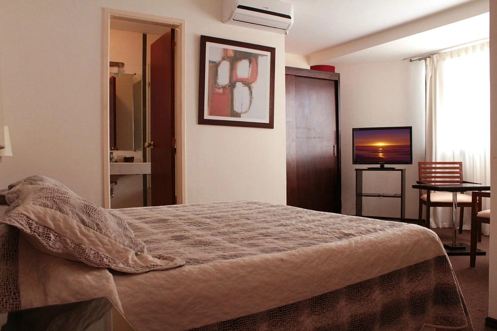 dormitorios_cama_hotel_genoves.webp